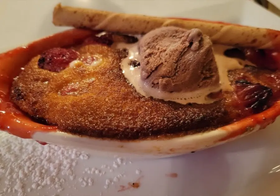 Warm fruit cobbler with chocolate ice cream
