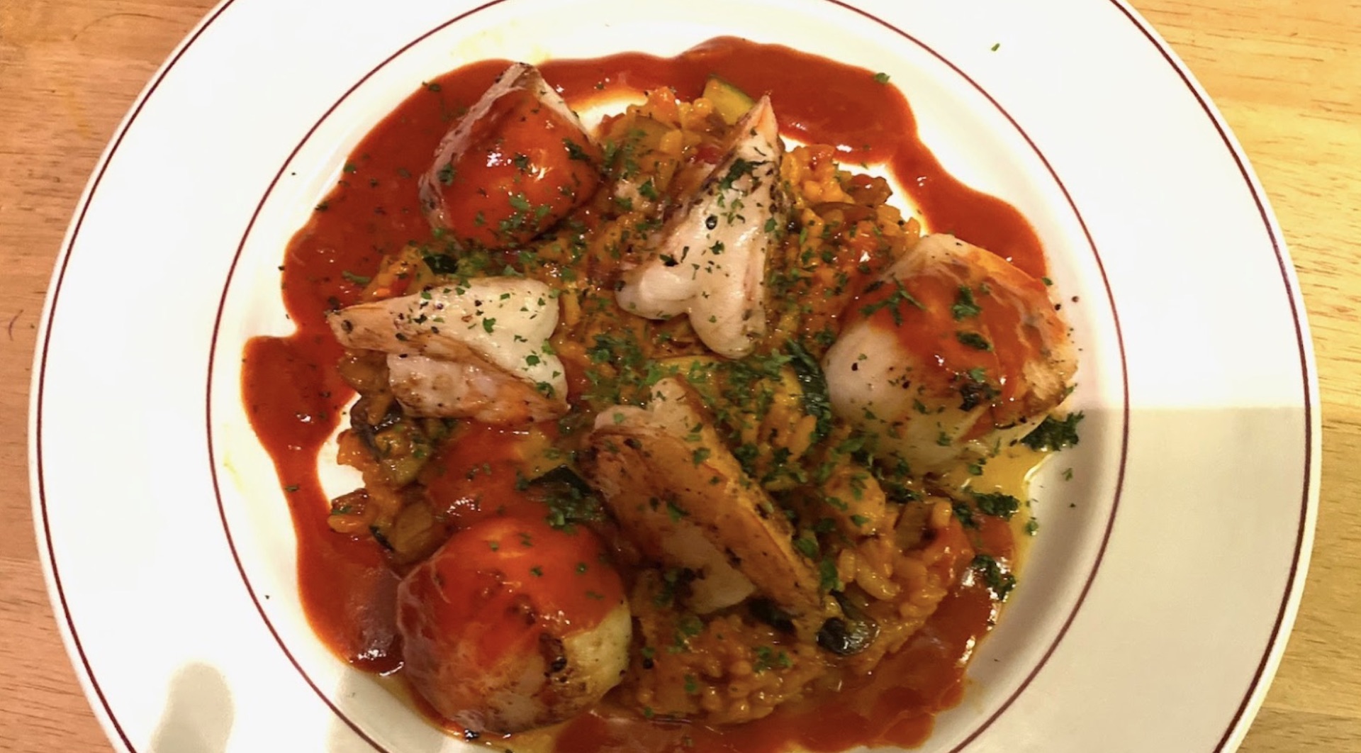 Pan seared sea scallops over risotto at Wine Sellars Bistro